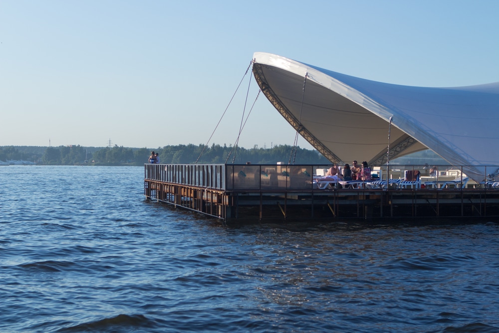 Luxury,Tent,Standing,On,The,Water.,White,Fabric,And,Floral